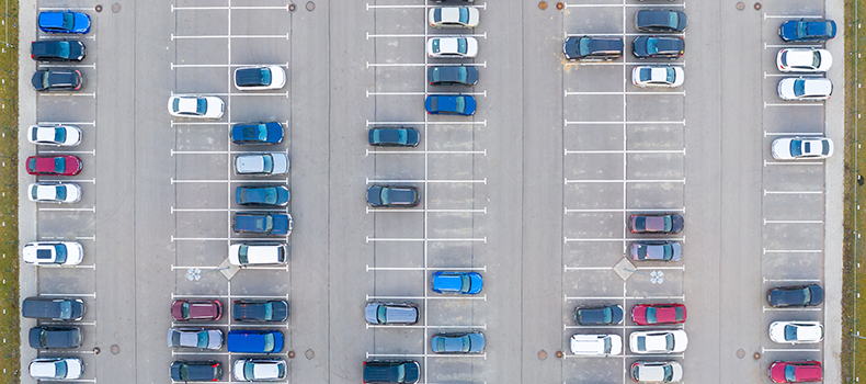Door-to-Door vs. Terminal-to-Terminal Car Shipping: Which Is Right for You? 2 multiple cars in parking lot (example of terminal-to-terminal car shipping)