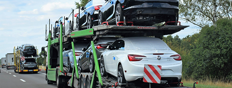 Understanding Car Shipping Deadlines: How to Plan Your Vehicle Pickup 1 vehicles being hauled on open trailer